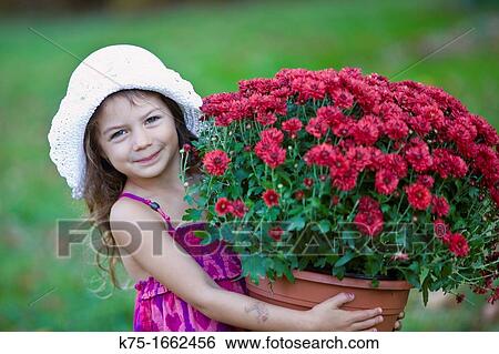 Little girl holding large pot of flowers View Large Photo Image Stock Photograph - Little girl holding large pot of flowers. Fotosearch