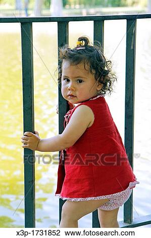 Little girl in a balcony View Large Photo Image Stock Image - Little girl in a balcony. Fotosearch