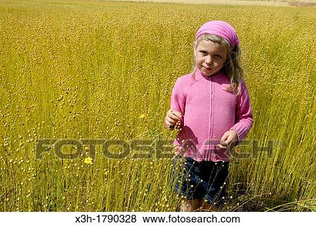 little girl in a flax field around Etretat, Cote d? Albatre, Pays de Caux, Seine-Maritime department, Upper Normandy region, France, Europe View Large Photo Image Stock Photo - little girl in a flax field around Etretat, Cote d? Albatre, Pays de Caux, Seine-Maritime department, Upper Normandy region, France, Europe. Fotosearch