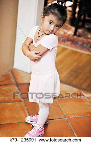 Little girl in ballet costume looking at camera. View Large Photo Image Stock Image - Little girl in ballet costume looking at camera.. Fotosearch