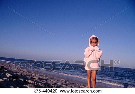 Little girl in sweatshirt at beach View Large Photo Image Stock Image - Little girl in sweatshirt at beach. Fotosearch