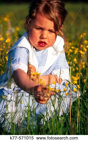 Stock Photography - Little girl in swedish meadow.? land. Sweden.. Fotosearch