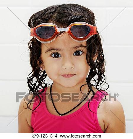 Little girl in swim suit and swim goggles. View Large Photo Image Picture - Little girl in swim suit and swim goggles.. Fotosearch