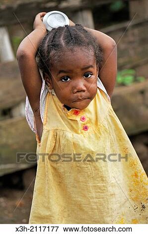 little girl in the village of Porto Alegre in the southern part of Sao Tome Island, Republic of Sao Tome and Principe, Africa. View Large Photo Image Stock Photo - little girl in the village of Porto Alegre in the southern part of Sao Tome Island, Republic of Sao Tome and Principe, Africa.. Fotosearch