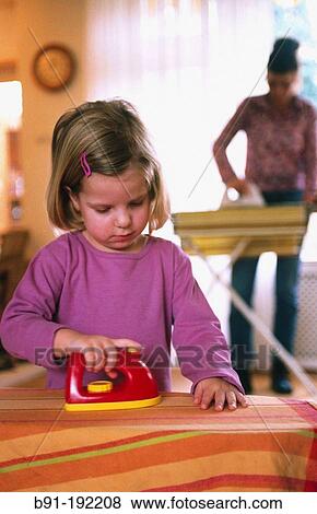 Little girl, ironing View Large Photo Image Stock Photo - Little girl, ironing. Fotosearch