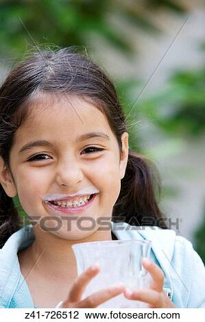 Little girl is drinking milk View Large Photo Image Stock Image - Little girl is drinking milk. Fotosearch