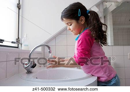 Little girl is washing her hands View Large Photo Image Stock Image - Little girl is washing her hands. Fotosearch