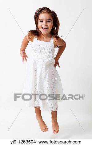 Picture - Little girl jumping. Fotosearch