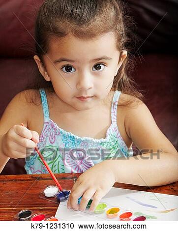 Little girl looking at camera and painting with children's paints. View Large Photo Image Stock Image - Little girl looking at camera and painting with children's paints.. Fotosearch