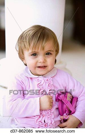 Stock Photography - Little girl looking at camera. Fotosearch