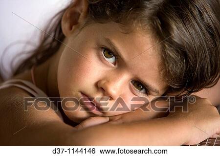 Little girl looking at the camera with big brown eyes View Large Photo Image Stock Photograph - Little girl looking at the camera with big brown eyes. Fotosearch
