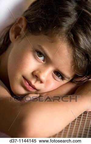 Little girl looking at the camera with big brown eyes View Large Photo Image Stock Photography - Little girl looking at the camera with big brown eyes. Fotosearch
