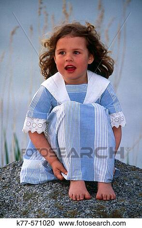 Little girl on a rock.? land. Sweden. View Large Photo Image Stock Image - Little girl on a rock.? land. Sweden.. Fotosearch