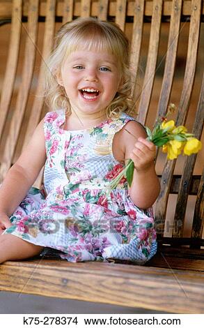 Little girl on porch with flowers View Large Photo Image Picture - Little girl on porch with flowers. Fotosearch