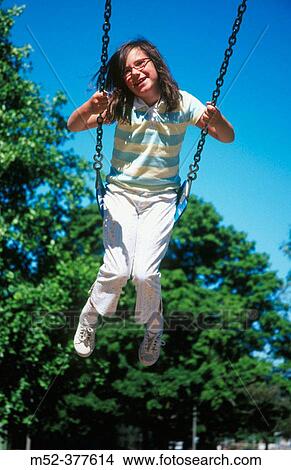 Little girl on swing View Large Photo Image Picture - Little girl on swing. Fotosearch