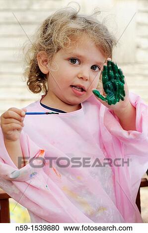 Little girl painting View Large Photo Image Stock Image - Little girl painting. Fotosearch
