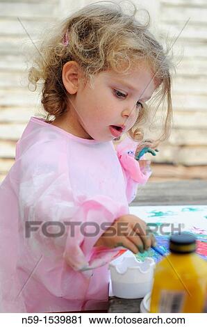 Little girl painting View Large Photo Image Stock Image - Little girl painting. Fotosearch