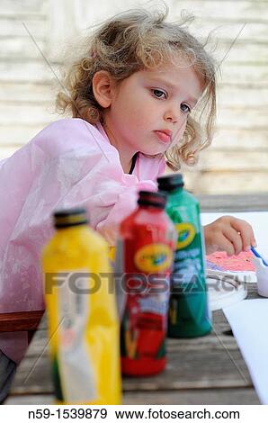 Little girl painting View Large Photo Image Stock Photo - Little girl painting. Fotosearch