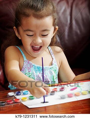 Little girl painting with children's paints. View Large Photo Image Stock Image - Little girl painting with children's paints.. Fotosearch
