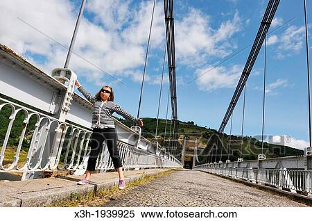 little girl playing on a suspension bridge, Pont de Treboul over La Truyere River, Cantal department, Auvergne region, France, Europe View Large Photo Image Stock Photography - little girl playing on a suspension bridge, Pont de Treboul over La Truyere River, Cantal department, Auvergne region, France, Europe. Fotosearch