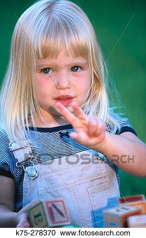 Little girl playing View Large Photo Image Stock Image - Little girl playing. Fotosearch
