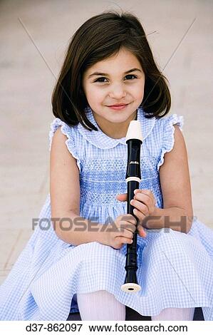 Little girl playing the flute View Large Photo Image Stock Photo - Little girl playing the flute. Fotosearch