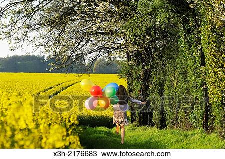 little girl playing with balloons in the fields, Eure-et-Loir department, Centre region, France, Europe. View Large Photo Image Stock Image - little girl playing with balloons in the fields, Eure-et-Loir department, Centre region, France, Europe.. Fotosearch