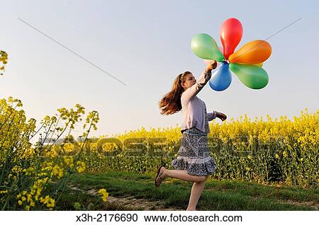 little girl playing with balloons in the fields, Eure-et-Loir department, Centre region, France, Europe. View Large Photo Image Stock Image - little girl playing with balloons in the fields, Eure-et-Loir department, Centre region, France, Europe.. Fotosearch