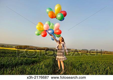little girl playing with balloons in the fields, Eure-et-Loir department, Centre region, France, Europe. View Large Photo Image Stock Photo - little girl playing with balloons in the fields, Eure-et-Loir department, Centre region, France, Europe.. Fotosearch