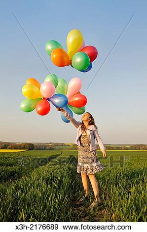little girl playing with balloons in the fields, Eure-et-Loir department, Centre region, France, Europe. View Large Photo Image Stock Photo - little girl playing with balloons in the fields, Eure-et-Loir department, Centre region, France, Europe.. Fotosearch