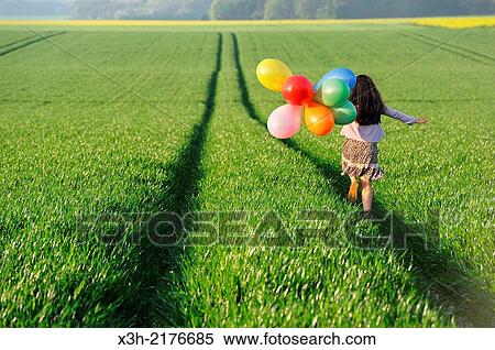 little girl playing with balloons in the fields, Eure-et-Loir department, Centre region, France, Europe. View Large Photo Image Stock Photography - little girl playing with balloons in the fields, Eure-et-Loir department, Centre region, France, Europe.. Fotosearch