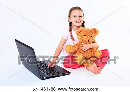 Little girl playing with laptop computer, Switzerland View Large Photo Image Stock Photo - Little girl playing with laptop computer, Switzerland. Fotosearch