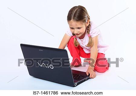 Little girl playing with laptop computer, Switzerland View Large Photo Image Stock Photograph - Little girl playing with laptop computer, Switzerland. Fotosearch