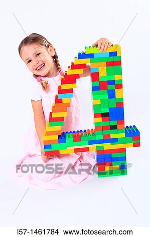 Little girl playing with Lego, Switzerland View Large Photo Image Picture - Little girl playing with Lego, Switzerland. Fotosearch
