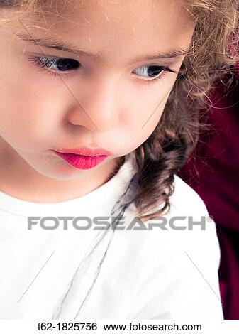 Little girl playing with lipstick View Large Photo Image Stock Photograph - Little girl playing with lipstick. Fotosearch