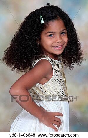 Little Girl posing smailing looking at the camera View Large Photo Image Stock Photo - Little Girl posing smailing looking at the camera. Fotosearch