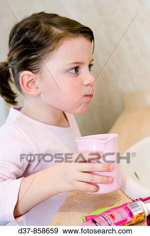 Little girl rinsing her mouth View Large Photo Image Stock Photo - Little girl rinsing her mouth. Fotosearch
