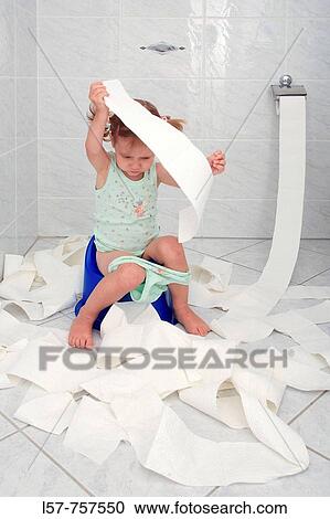 Little girl sitting on Potty in bathroom, unrolling toilette paper while doing potty training, playing and fooling around View Large Photo Image Stock Image - Little girl sitting on Potty in bathroom, unrolling toilette paper while doing potty training, playing and fooling around. Fotosearch