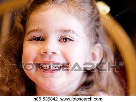 Little girl smiling View Large Photo Image Stock Image - Little girl smiling. Fotosearch
