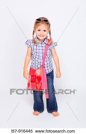 little girl standing with handbag over shoulder wearing sunglases, Switzerland View Large Photo Image Stock Photography - little girl standing with handbag over shoulder wearing sunglases, Switzerland. Fotosearch