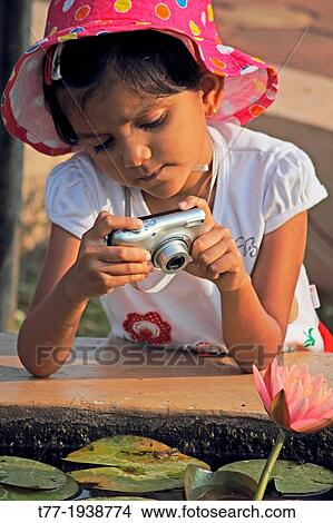 Little girl taking photo View Large Photo Image Picture - Little girl taking photo. Fotosearch