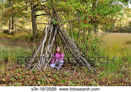 little girl under an hut, Forest of Rambouillet, Yvelines department, Ile-de-France region, France, Europe View Large Photo Image Stock Photograph - little girl under an hut, Forest of Rambouillet, Yvelines department, Ile-de-France region, France, Europe. Fotosearch