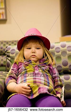 Little girl waiting at the hospital bloated from the side effects of chemo therapy and being in pain View Large Photo Image Stock Image - Little girl waiting at the hospital bloated from the side effects of chemo therapy and being in pain. Fotosearch