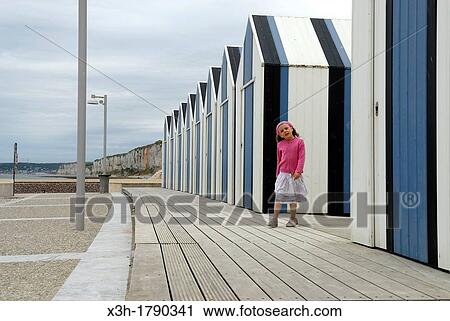 little girl walking in front of the bathing huts on the beach of Yport near Etretat, Cote d? Albatre, Pays de Caux, Seine-Maritime department, Upper Normandy region, France, Europe View Large Photo Image Stock Image - little girl walking in front of the bathing huts on the beach of Yport near Etretat, Cote d? Albatre, Pays de Caux, Seine-Maritime department, Upper Normandy region, France, Europe. Fotosearch
