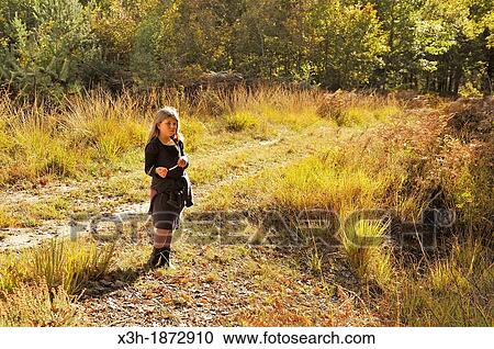 little girl walking on a path in the Forest of Rambouillet, Yvelines department, Ile-de-France region, France, Europe View Large Photo Image Stock Image - little girl walking on a path in the Forest of Rambouillet, Yvelines department, Ile-de-France region, France, Europe. Fotosearch