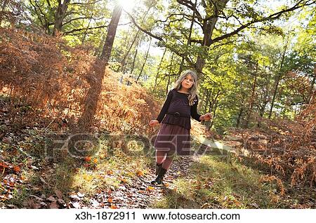 little girl walking on a path in the Forest of Rambouillet, Yvelines department, Ile-de-France region, France, Europe View Large Photo Image Stock Image - little girl walking on a path in the Forest of Rambouillet, Yvelines department, Ile-de-France region, France, Europe. Fotosearch
