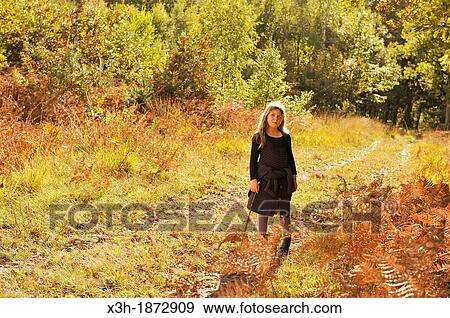 Stock Photo - little girl walking on a path in the Forest of Rambouillet, Yvelines department, Ile-de-France region, France, Europe. Fotosearch