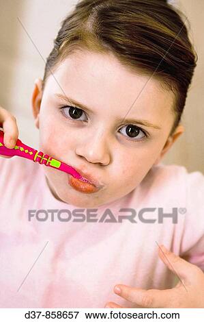 Stock Photo - Little girl washing her teeth. Fotosearch