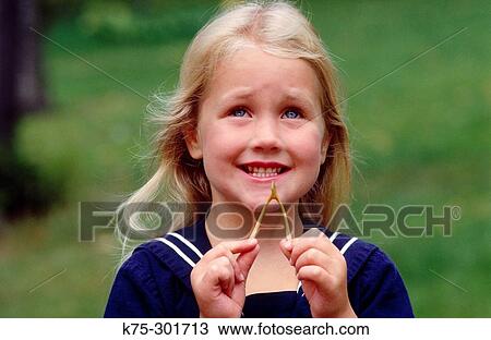 Little girl wishing on a wishbone View Large Photo Image Stock Image - Little girl wishing on a wishbone. Fotosearch