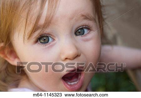 Little girl with big eyes singing View Large Photo Image Stock Image - Little girl with big eyes singing. Fotosearch
